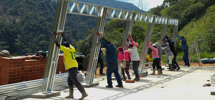 Raising a building frame in rural Colombia